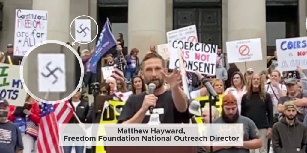 Matthew Hayward speaking at a protest.